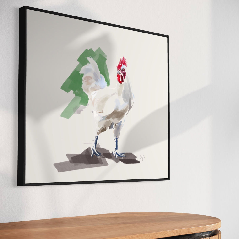 Framed artwork of a rooster on a white wall above a wooden piece of furniture.
