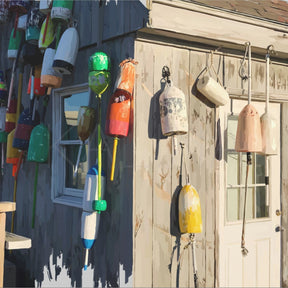 Colorful buoys hanging on a wooden shed with a white door.
