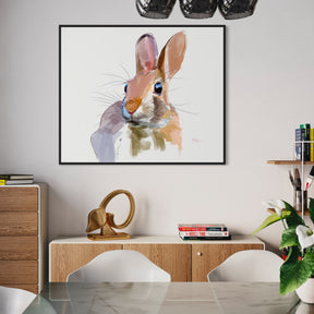 Dining room with a framed artwork of a rabbit on the wall