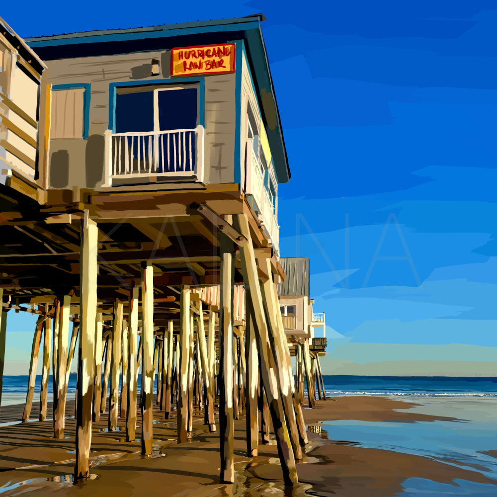 Beach house on stilts with ocean view under a clear blue sky